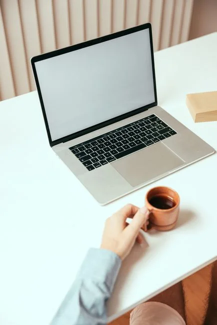 A tablet with a financial website open, alongside a white keyboard and mouse. Ideal for tech-theme stock images.